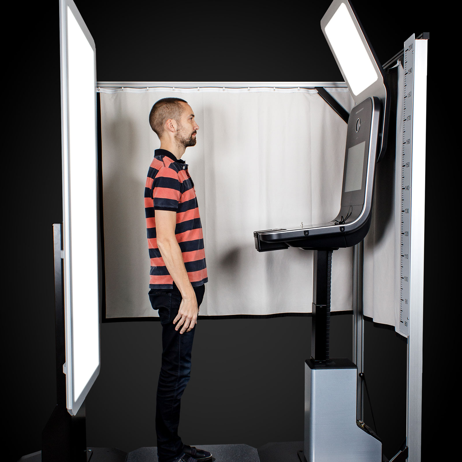 A man standing in a photo kiosk