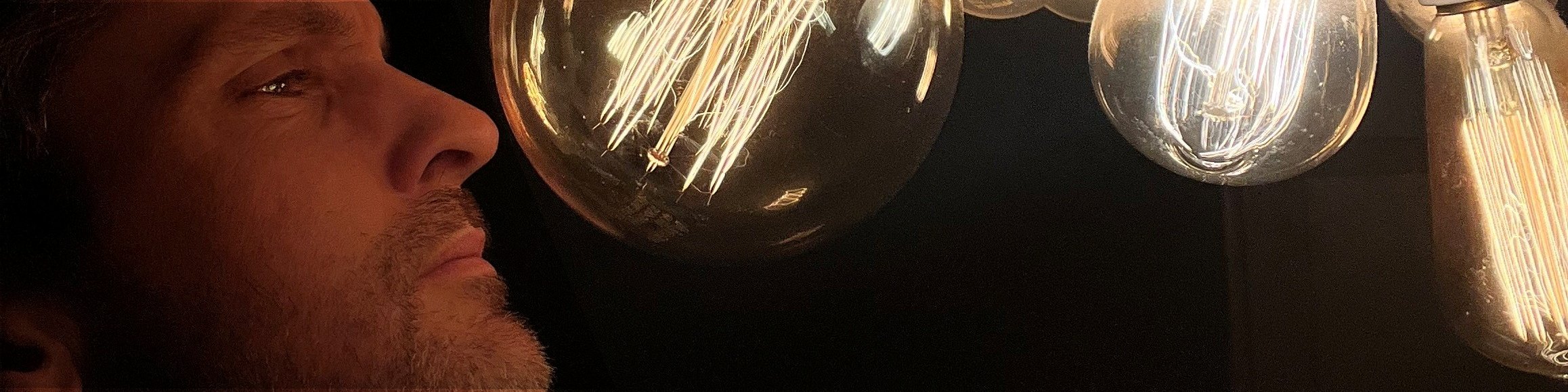 Light bulbs shining on a face